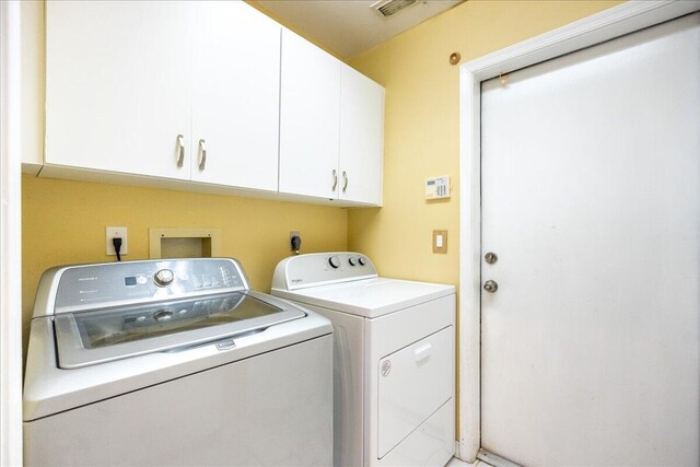 761 SW Lighthouse Dr, Palm City, FL 34990 - laundry room with separate washer and dryer, cabinet space, and visible vents