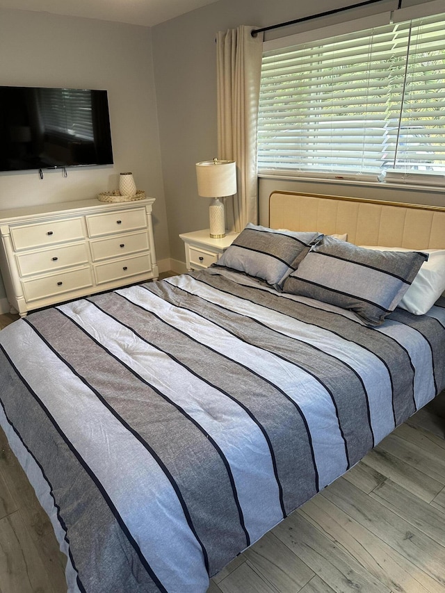 5111 NE 27th Ter NE, Lighthouse Point, FL 33064 - bedroom featuring wood finished floors and multiple windows