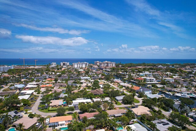 birds eye view of property with a water view and a residential view