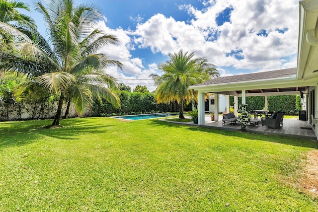 view of yard featuring a patio area and an outdoor pool