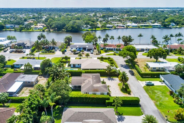 birds eye view of property featuring a water view and a residential view