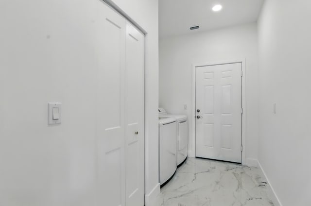 5104 Birch Dr, Fort Pierce, FL 34982 - entryway with independent washer and dryer, light marble finish flooring, baseboards, and recessed lighting