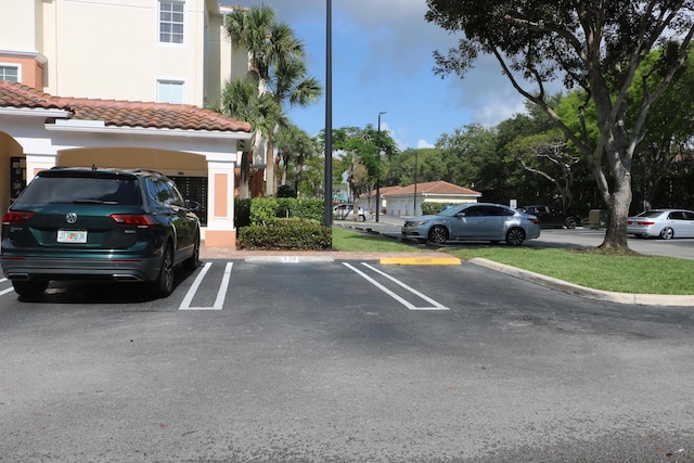 9825 Baywinds Dr Unit 1208, West Palm Beach, FL 33411 - view of uncovered parking lot