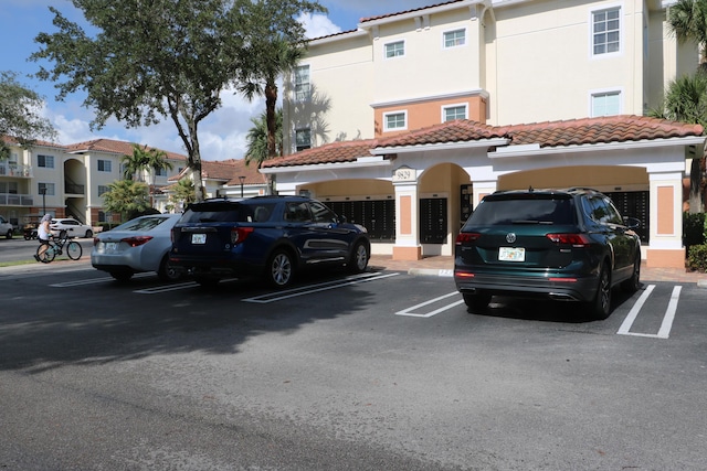 9825 Baywinds Dr Unit 1208, West Palm Beach, FL 33411 - view of uncovered parking lot