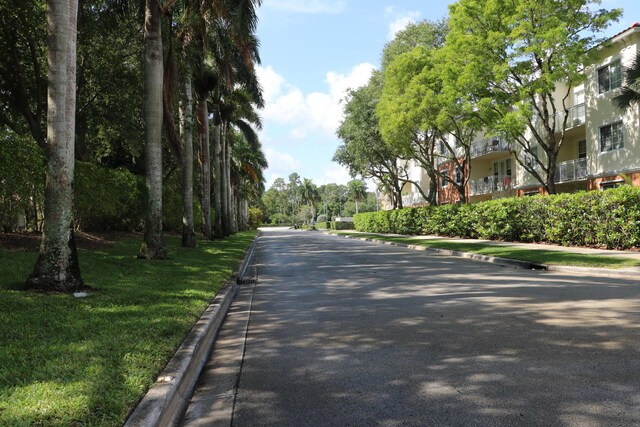 9825 Baywinds Dr Unit 1208, West Palm Beach, FL 33411 - view of asphalt street with curbs and sidewalks