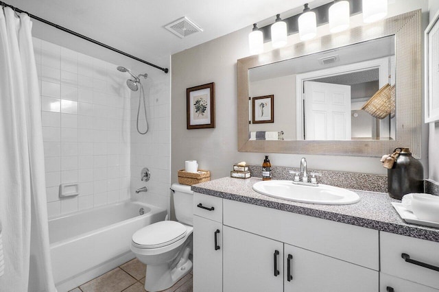 5031 Wiles Rd Unit 104, Coconut Creek, FL 33073 - full bath with visible vents, tile patterned flooring, shower / tub combo, vanity, and toilet
