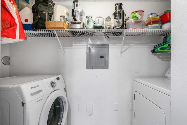 5031 Wiles Rd Unit 104, Coconut Creek, FL 33073 - laundry area featuring electric panel, laundry area, and washing machine and clothes dryer