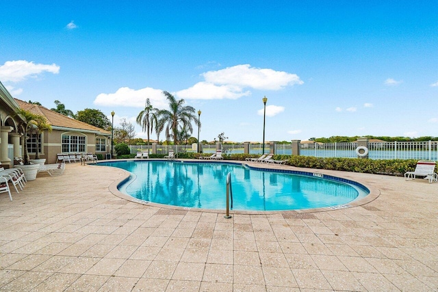 5031 Wiles Rd Unit 104, Coconut Creek, FL 33073 - pool featuring a patio and fence