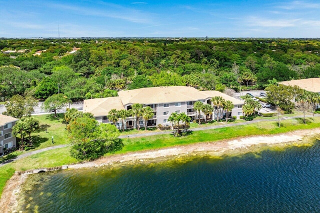 5031 Wiles Rd Unit 104, Coconut Creek, FL 33073 - bird's eye view with a water view and a wooded view