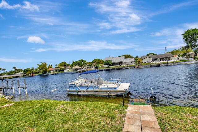 view of dock featuring a residential view and a water view