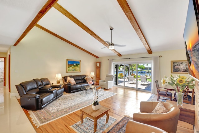 living room with a ceiling fan, lofted ceiling with beams, and light wood-style floors