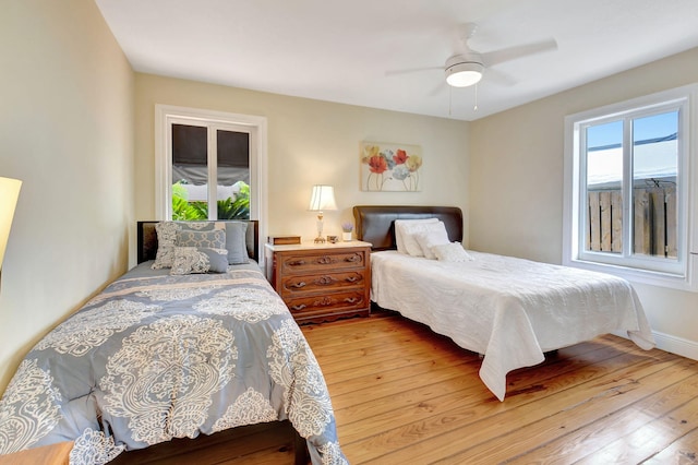 147 Oregon Ln, Boca Raton, FL 33487 - bedroom featuring hardwood / wood-style floors, ceiling fan, and baseboards