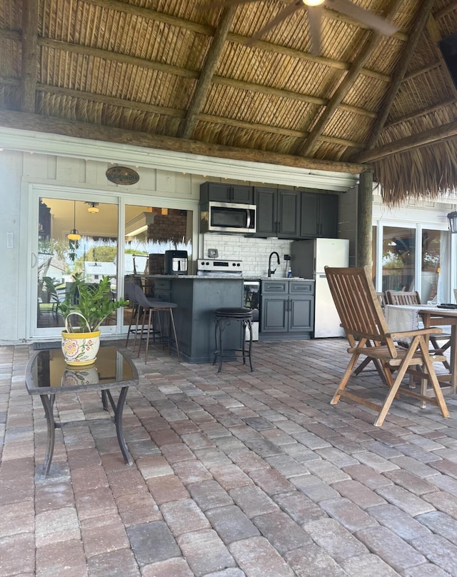 view of patio / terrace featuring a sink and a bar