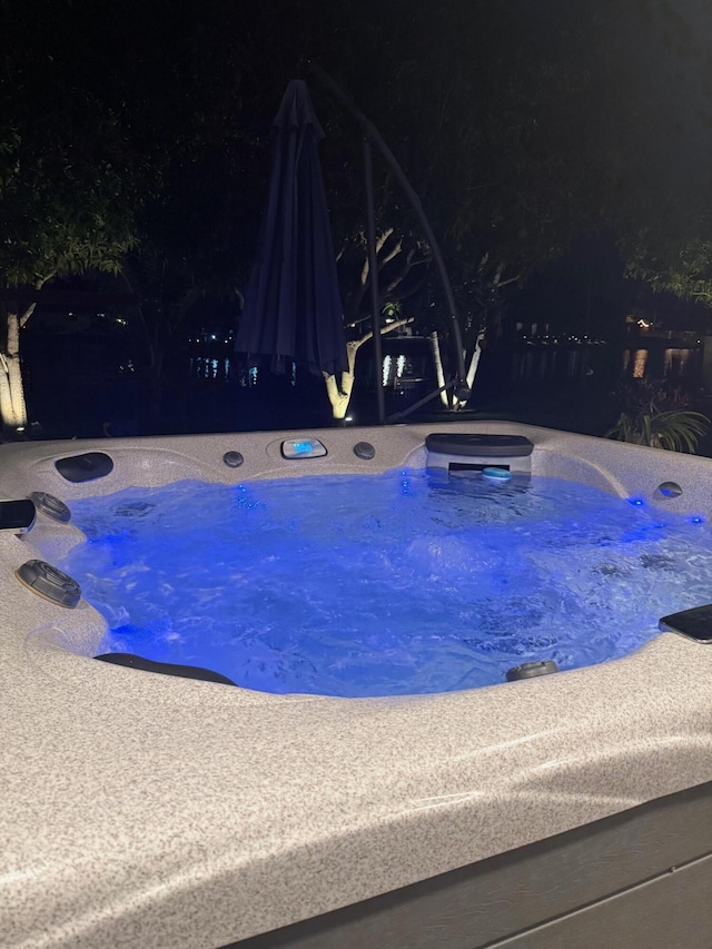 147 Oregon Ln, Boca Raton, FL 33487 - pool at twilight with an outdoor hot tub