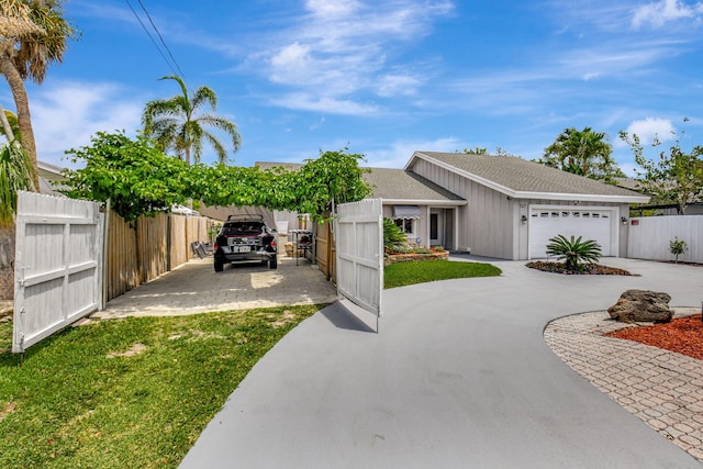147 Oregon Ln, Boca Raton, FL 33487 - view of front of house with concrete driveway and a garage