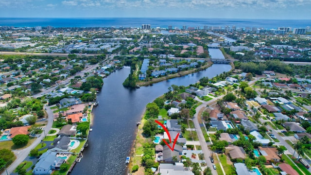 bird's eye view featuring a water view and a residential view