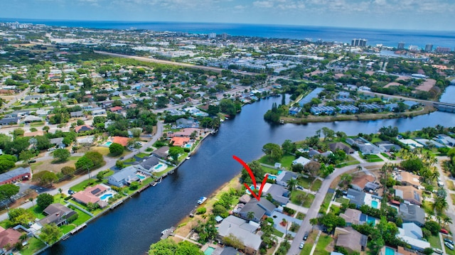 bird's eye view with a water view and a residential view