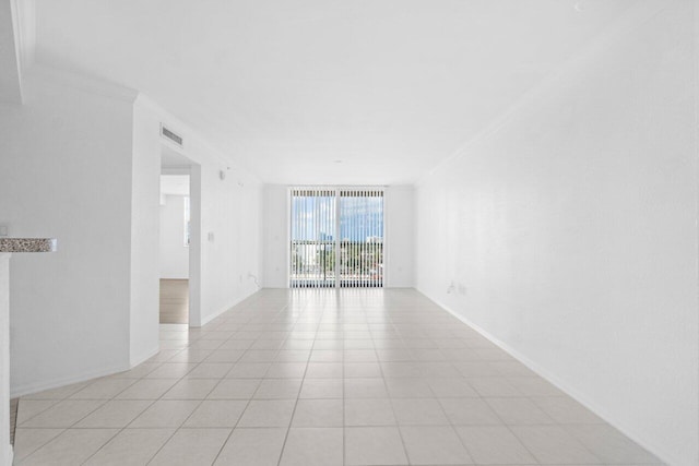 1801 N Flagler Dr Unit 828, West Palm Beach, FL 33407 - spare room featuring ornamental molding, floor to ceiling windows, and baseboards