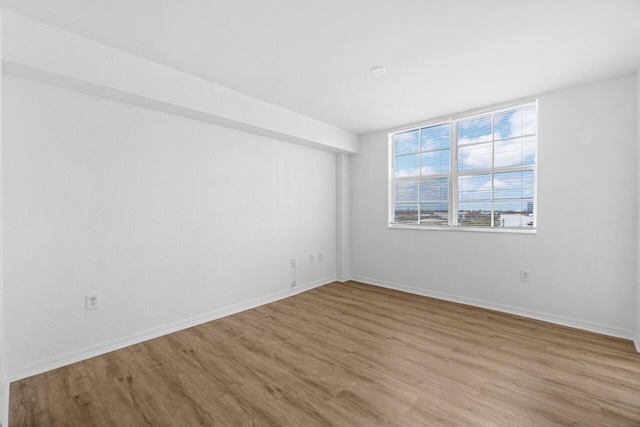 1801 N Flagler Dr Unit 828, West Palm Beach, FL 33407 - spare room with wood finished floors and baseboards