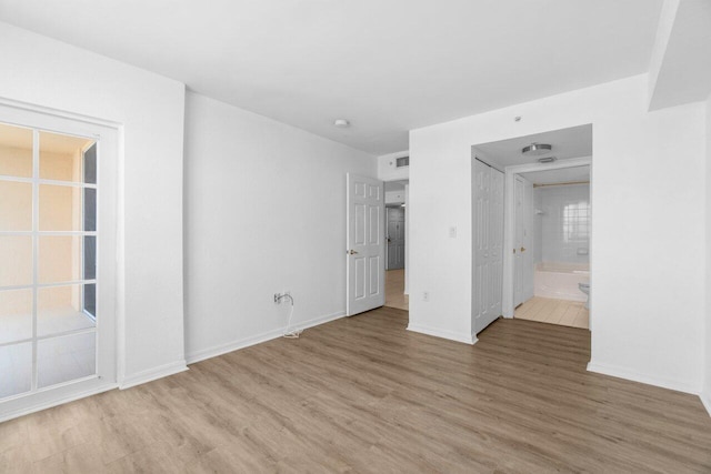 1801 N Flagler Dr Unit 828, West Palm Beach, FL 33407 - unfurnished bedroom with light wood finished floors and baseboards