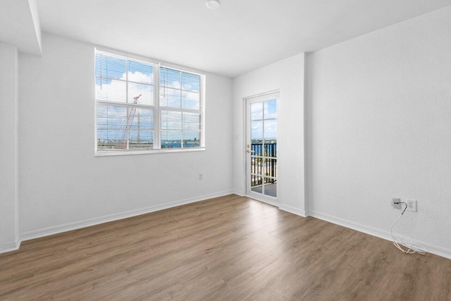 1801 N Flagler Dr Unit 828, West Palm Beach, FL 33407 - empty room featuring wood finished floors and baseboards