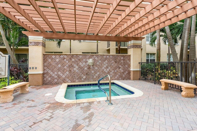 1801 N Flagler Dr Unit 828, West Palm Beach, FL 33407 - view of swimming pool featuring a community hot tub, a pergola, and fence