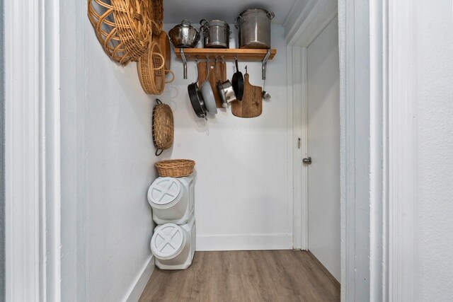 room details featuring baseboards and wood finished floors