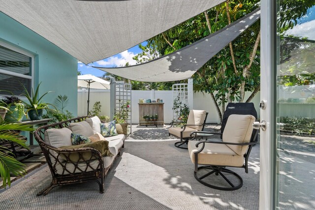 view of patio featuring fence