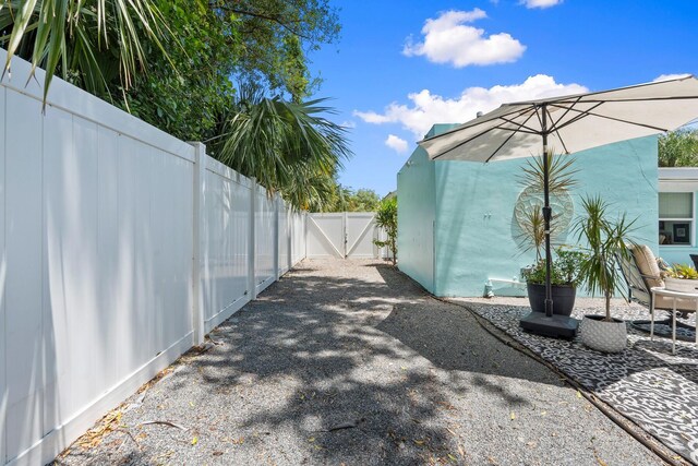 view of yard with fence and a gate
