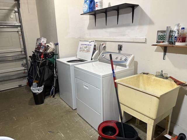 washroom with washing machine and clothes dryer and tile patterned floors
