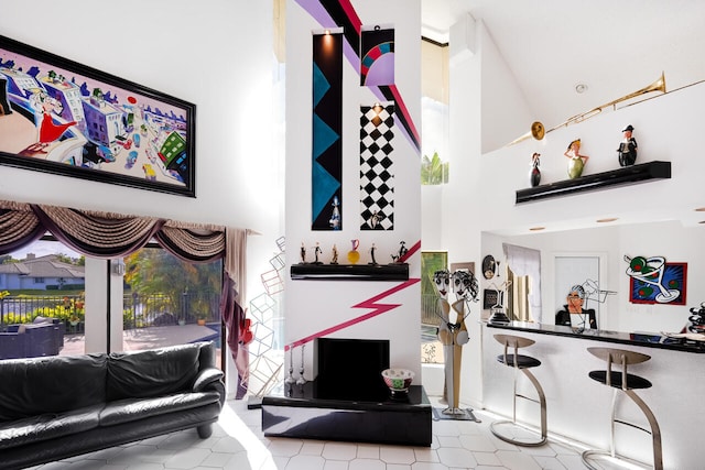 living room featuring high vaulted ceiling