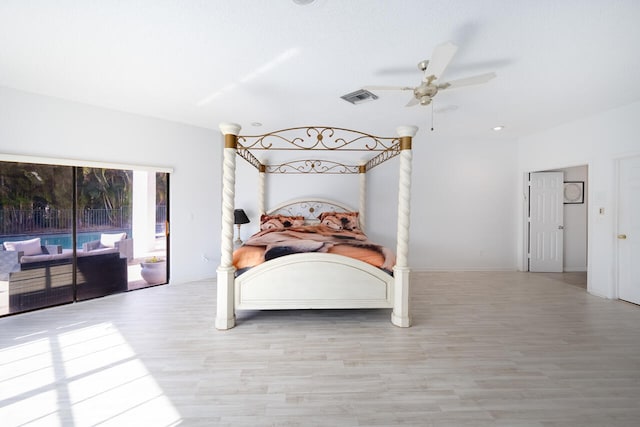 bedroom featuring ceiling fan, access to outside, wood finished floors, and visible vents