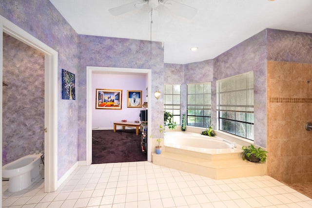 bathroom with a garden tub, ceiling fan, tiled shower, tile patterned floors, and a bidet