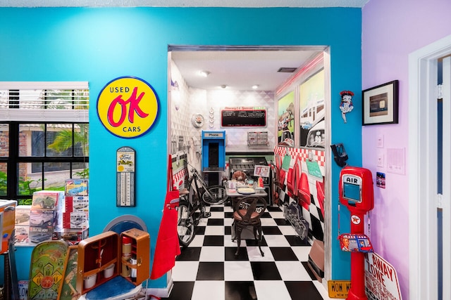 game room featuring tile patterned floors
