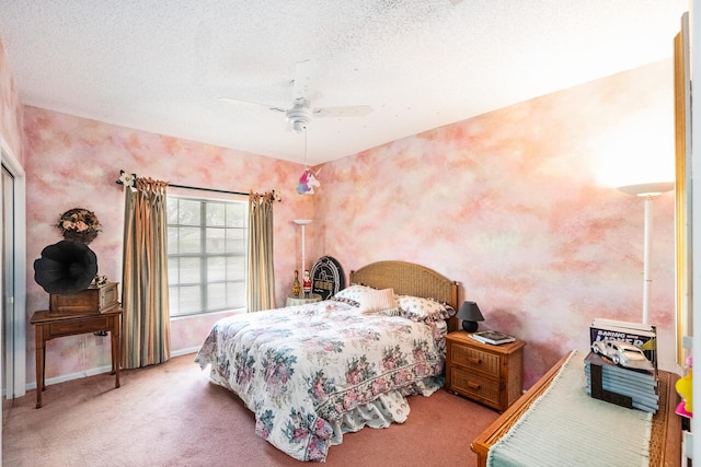 carpeted bedroom featuring a ceiling fan and baseboards
