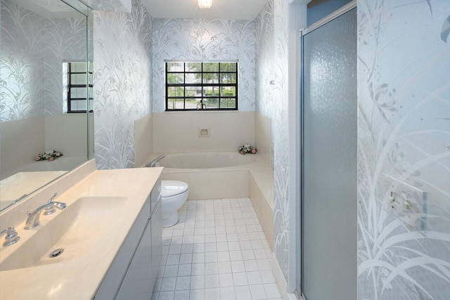 bathroom with vanity, tile patterned flooring, toilet, wallpapered walls, and a bath