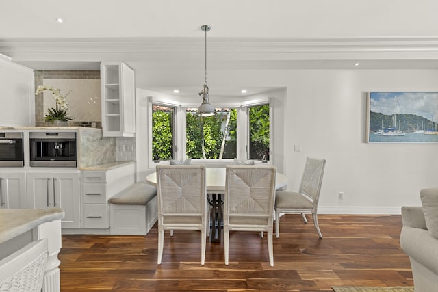 103 River Dr, Tequesta, FL 33469 - dining area featuring dark wood finished floors, baseboards, recessed lighting, and crown molding