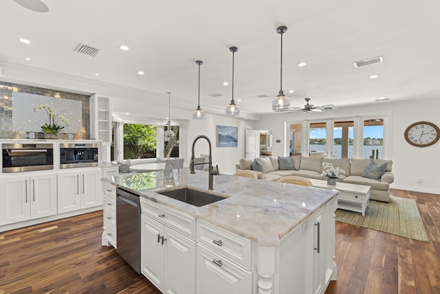 103 River Dr, Tequesta, FL 33469 - kitchen featuring a sink, appliances with stainless steel finishes, crown molding, ceiling fan, and dark wood finished floors