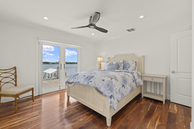 103 River Dr, Tequesta, FL 33469 - bedroom with crown molding, access to exterior, dark wood-style flooring, a water view, and ceiling fan