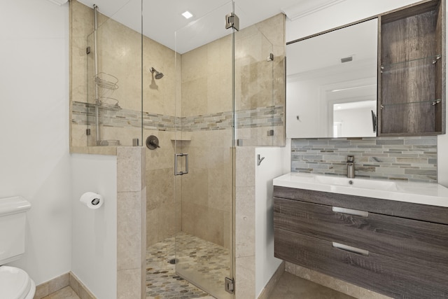 103 River Dr, Tequesta, FL 33469 - bathroom with toilet, vanity, a shower stall, decorative backsplash, and baseboards