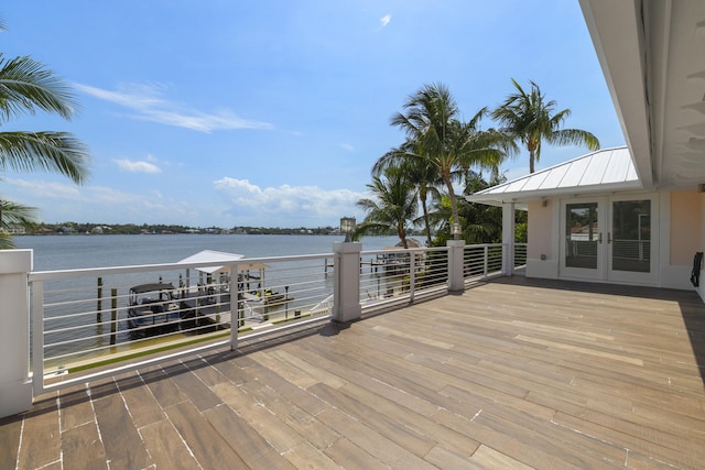 103 River Dr, Tequesta, FL 33469 - wooden deck featuring a water view and french doors