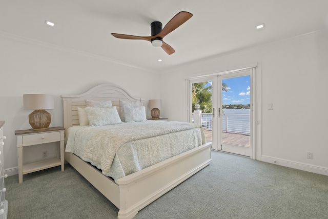 103 River Dr, Tequesta, FL 33469 - bedroom featuring access to outside, carpet, ornamental molding, a water view, and ceiling fan