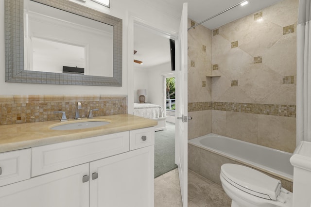 103 River Dr, Tequesta, FL 33469 - bathroom with vanity, toilet, decorative backsplash, tile patterned floors, and tiled shower / bath