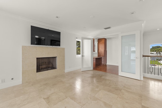 103 River Dr, Tequesta, FL 33469 - unfurnished living room with crown molding, baseboards, and a fireplace