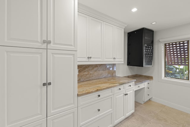 103 River Dr, Tequesta, FL 33469 - kitchen featuring baseboards, light stone counters, white cabinets, backsplash, and recessed lighting