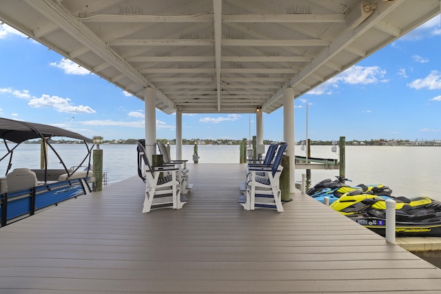 103 River Dr, Tequesta, FL 33469 - dock area featuring boat lift and a water view
