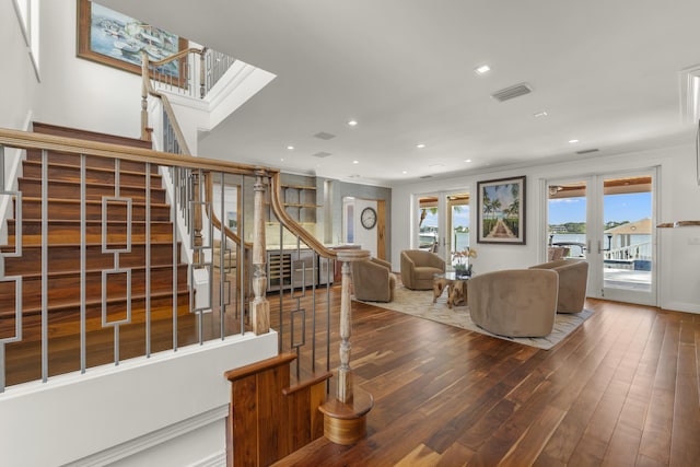103 River Dr, Tequesta, FL 33469 - living area featuring hardwood / wood-style flooring, stairway, recessed lighting, and crown molding