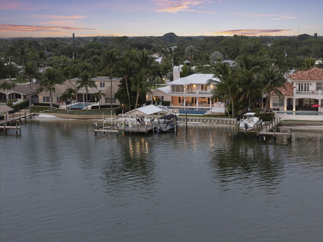 103 River Dr, Tequesta, FL 33469 - water view with boat lift, a boat dock, and nearby suburban area