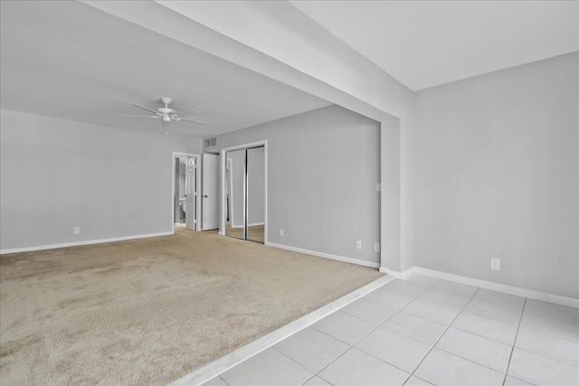 1640 Twelve Oaks Way Unit 205, North Palm Beach, FL 33408 - spare room with baseboards, light colored carpet, and ceiling fan