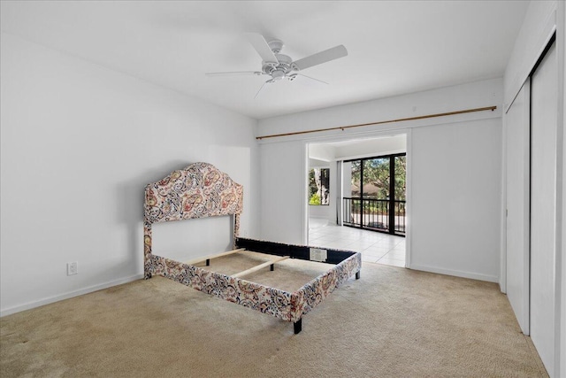 1640 Twelve Oaks Way Unit 205, North Palm Beach, FL 33408 - bedroom featuring baseboards, carpet, and a ceiling fan